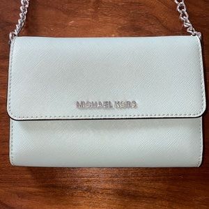 Moderately used Michael Kors light blue crossbody purse
